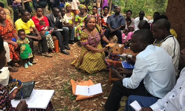 Women and men saving together in Rwanda. Angeline Munzara/World Vision