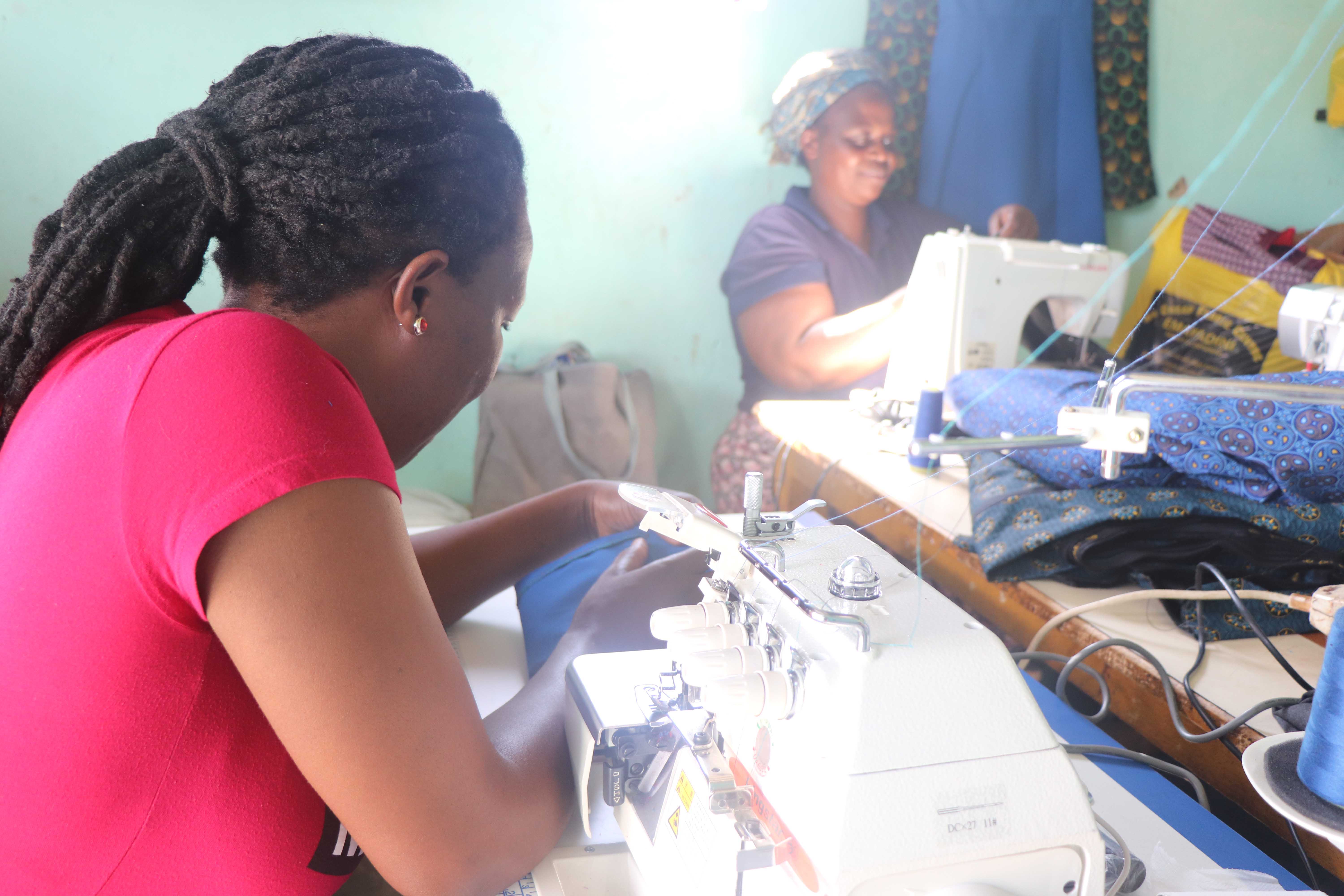 EMATHEKU SEWING MACHINE MAKING SURE THAT NO CHILD FROM MGAMUDZE COMMUNITY WEARS TORN UNIFORM 