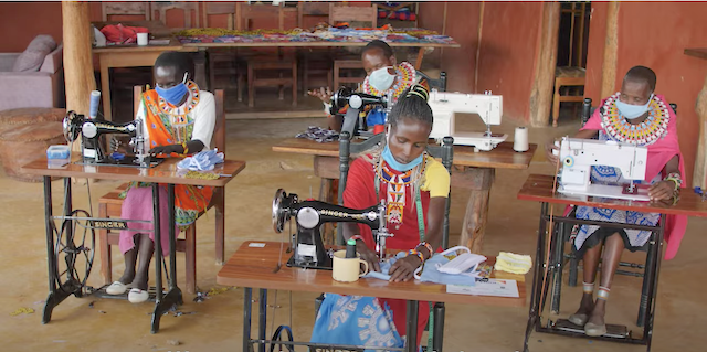 The Chui Mama women's group making clothes using sewing machines in Laikipia County, Kenya.