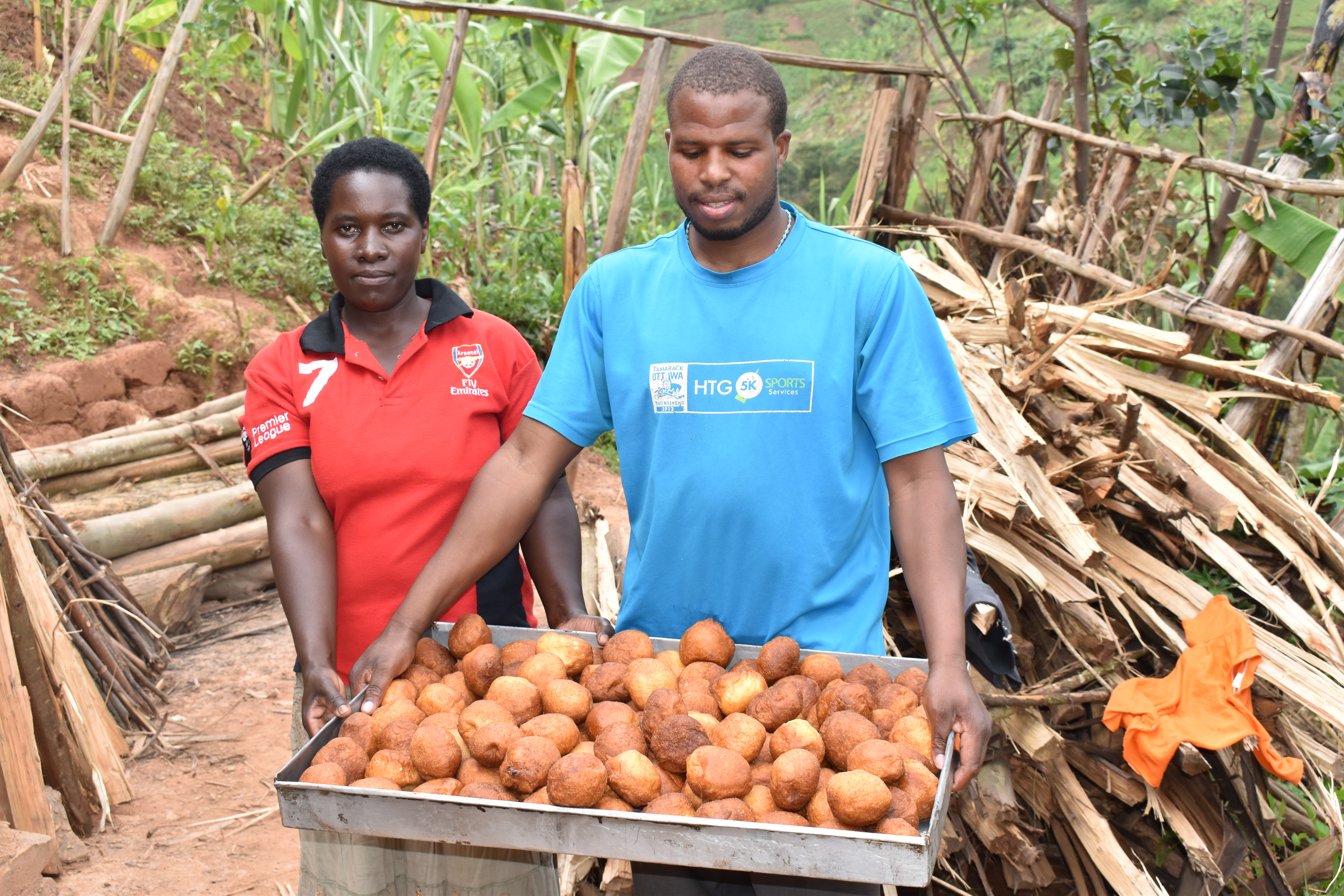 Jean de Dieu and his wife with some of his fresh half cakes