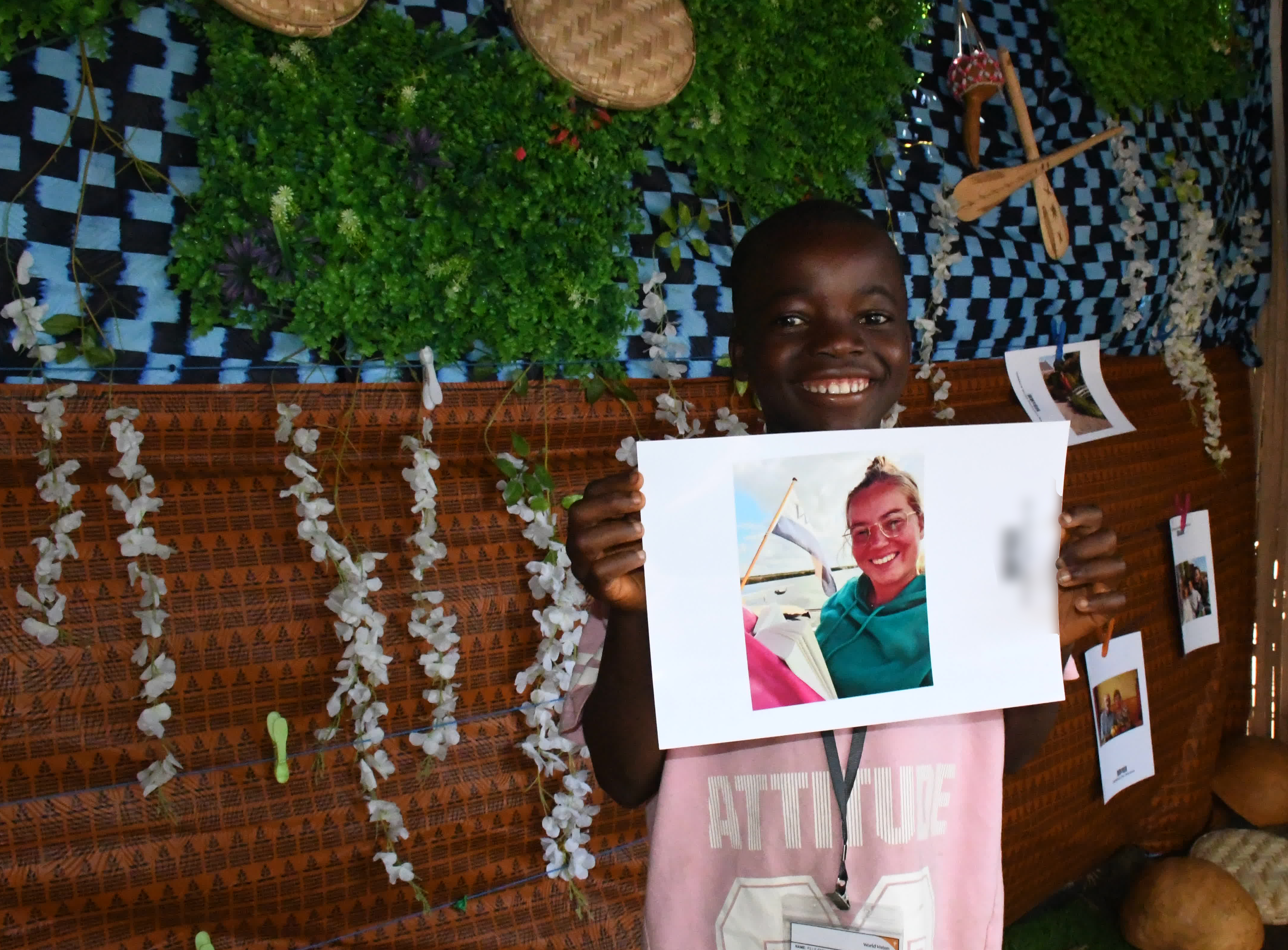 Tamba holding the photo of his sponsor