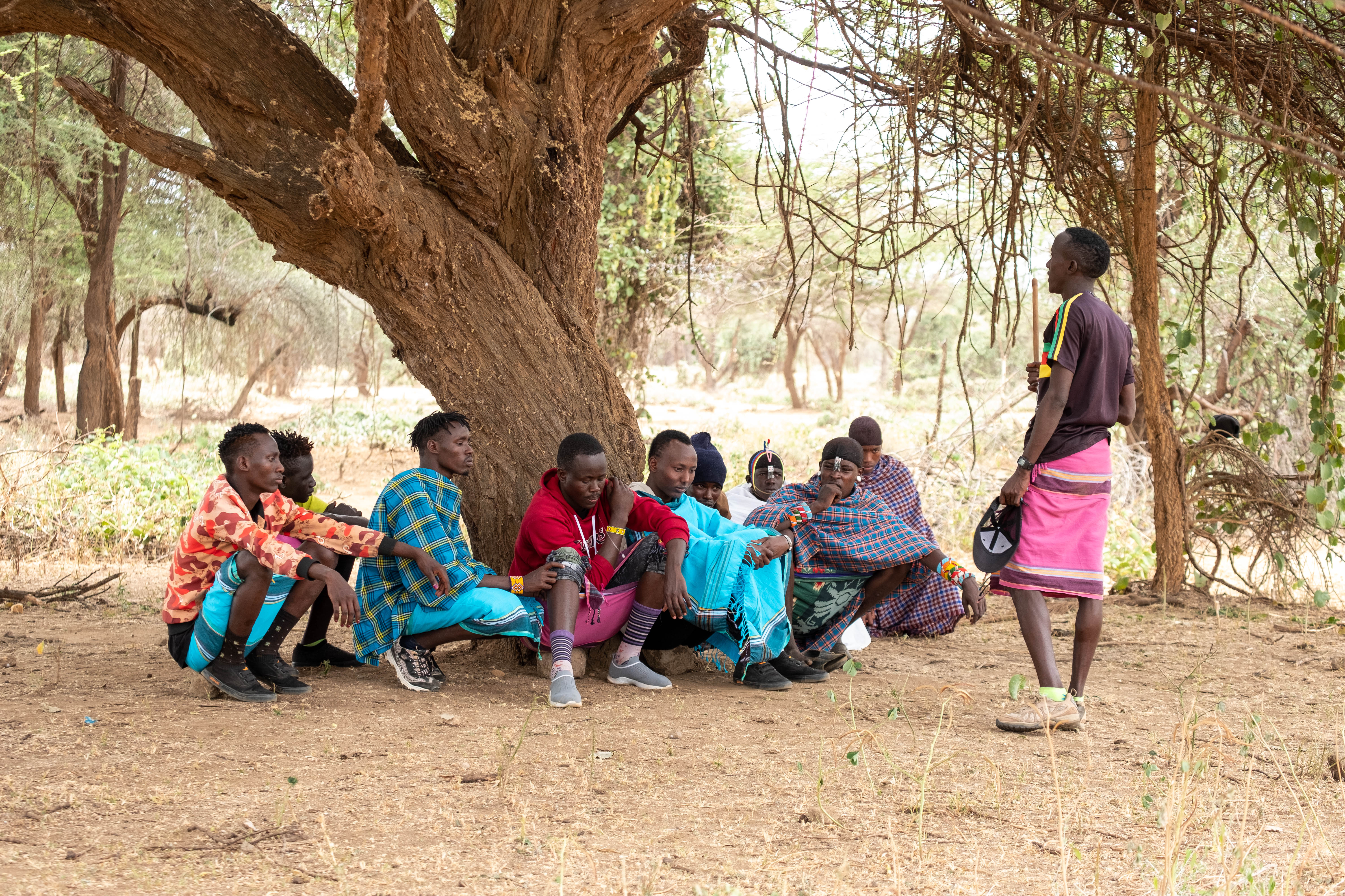 Reformed morans engage in conversation in Samburu