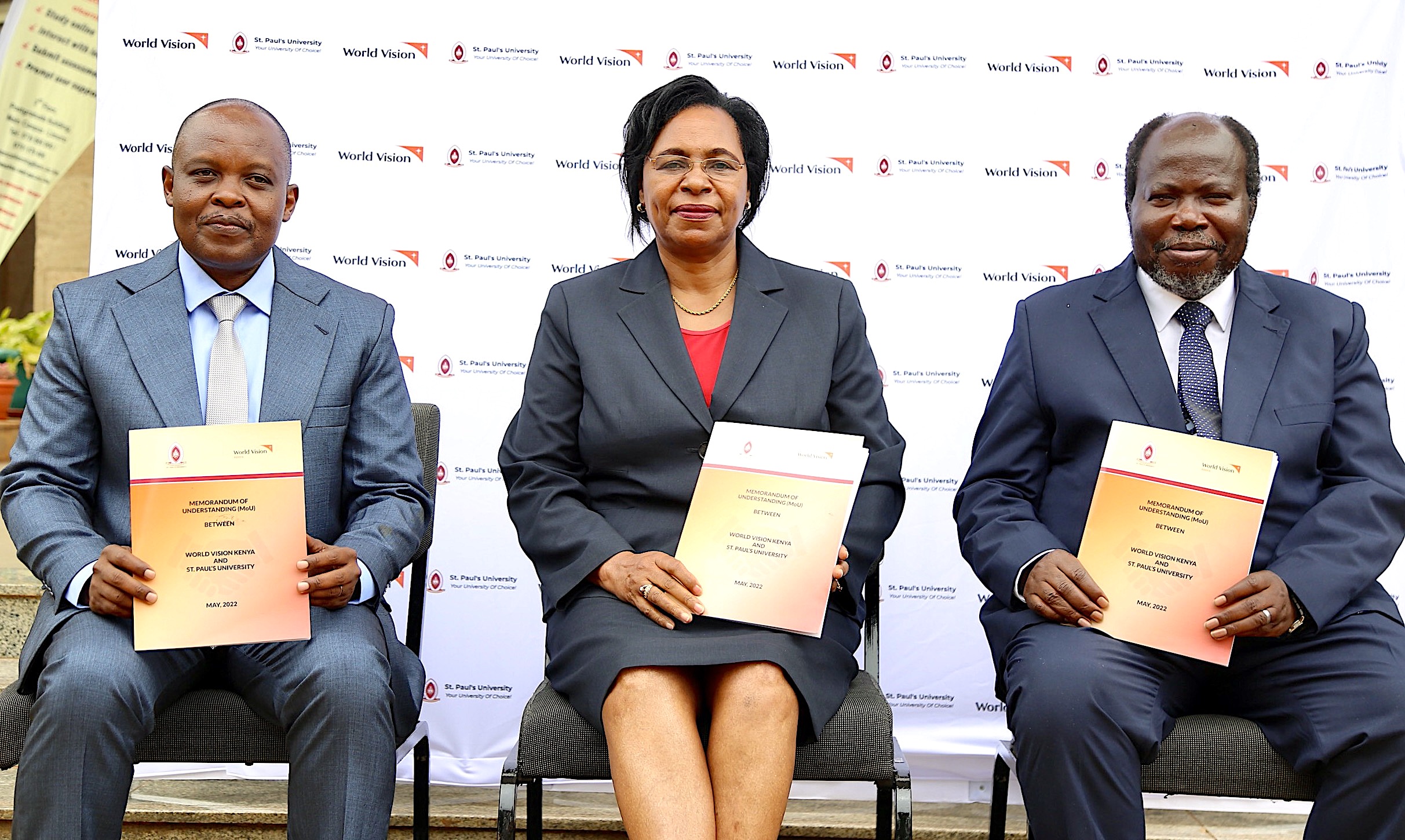 World Vision Kenya Acting National Director, St Paul's University & Kenya CS Prof Margaret Kobia and St Paul's University VC Prof Kombo pose with the signed MOUs at the World Vision Kenya Office