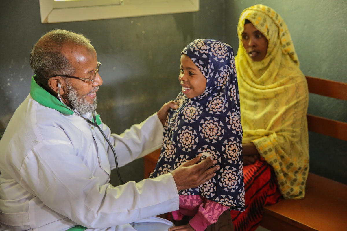 Doctor checks a girls lungs