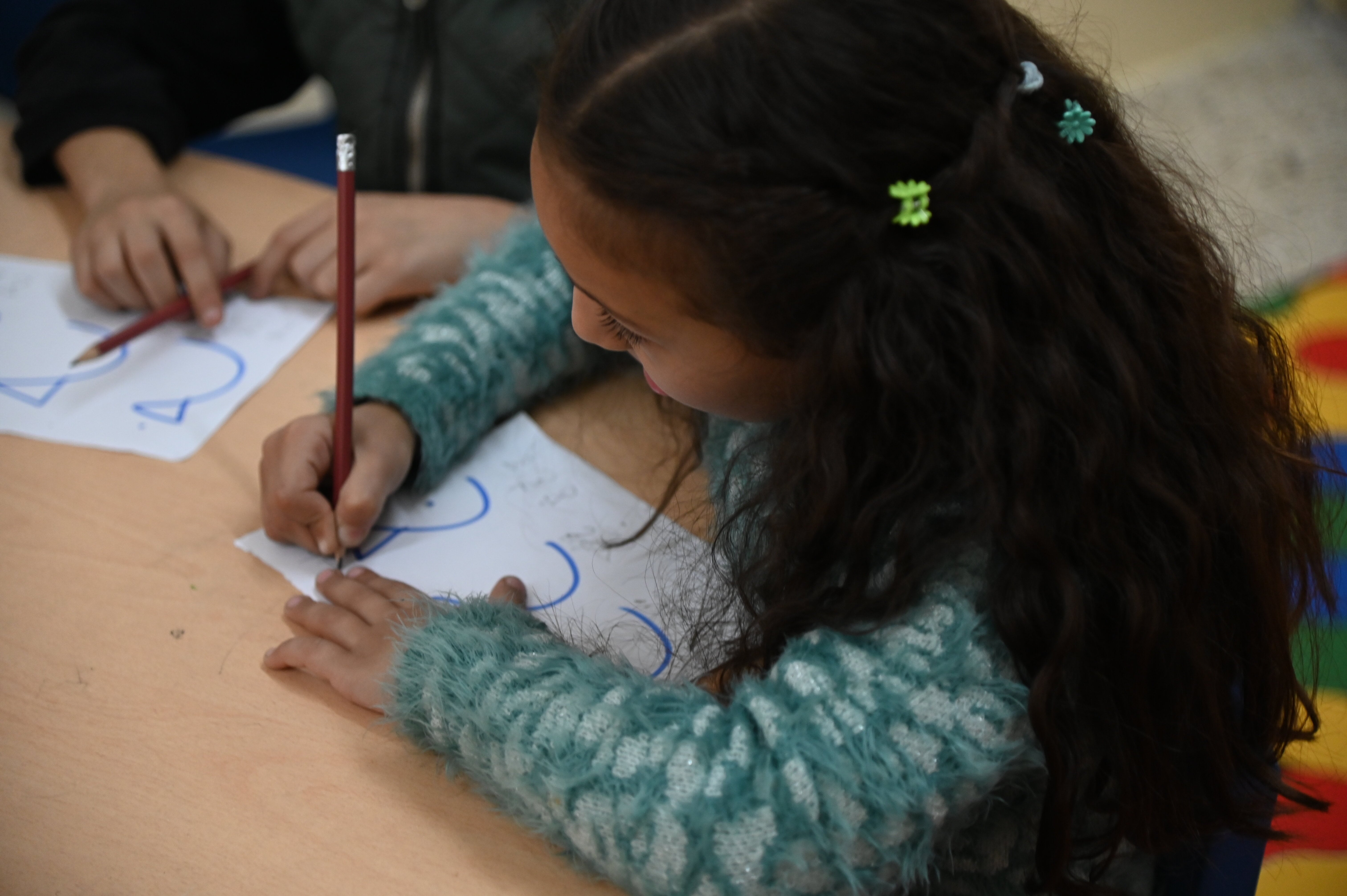 Girl writing during the session