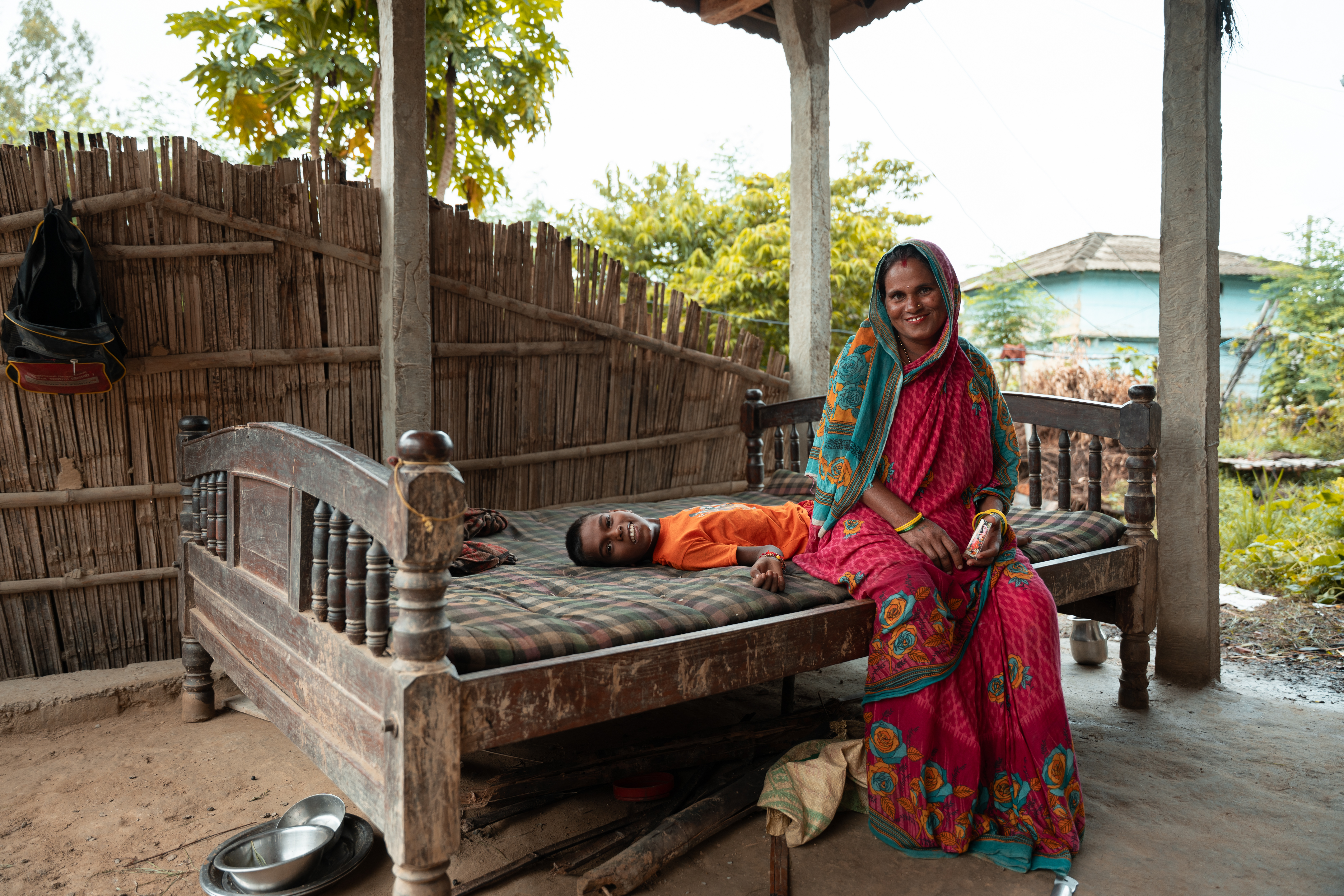 Shivasankhar and Lalita, rest at home. In addition to caring for her children, Lalita supports the family business