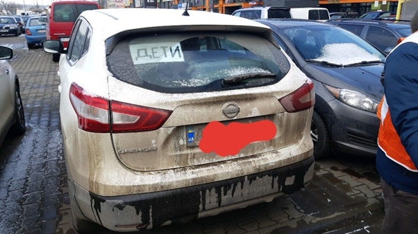 Car from Ukraine  with a sign saying 'children'