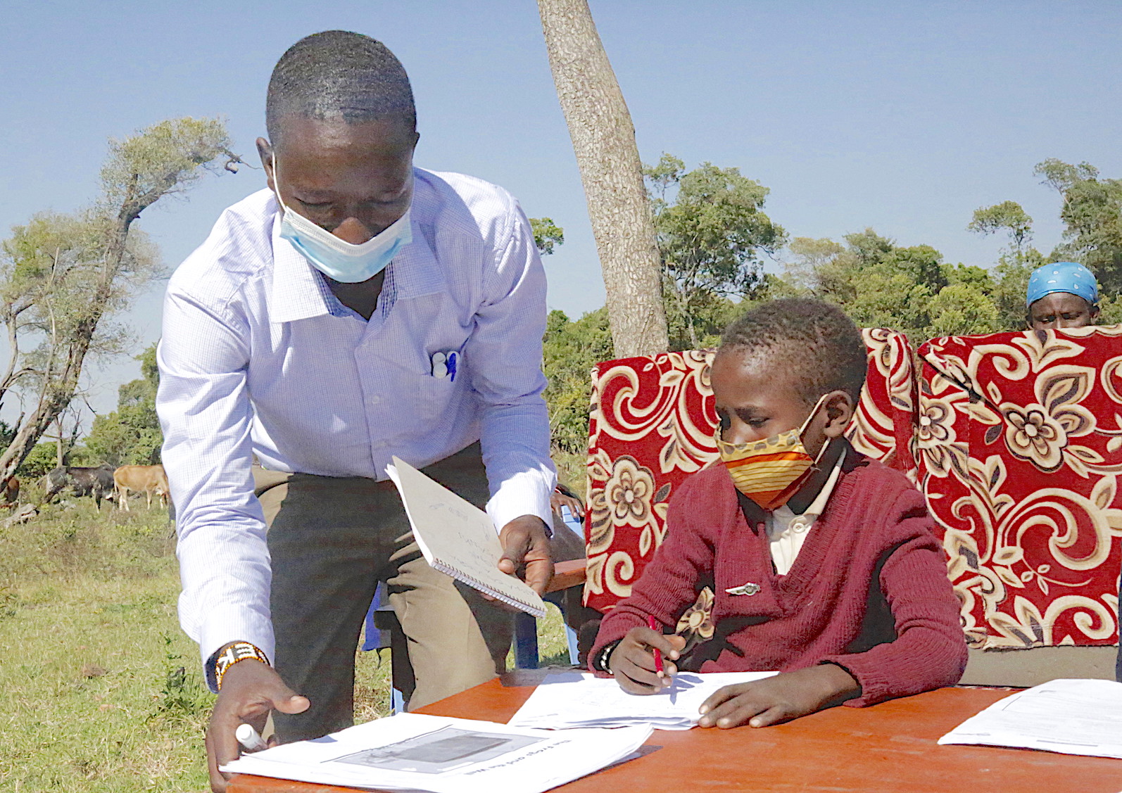 Teacher Ezekiel enjoys teaching children and helping the boost their literacy skills. ©World Vision Photo/Irene Sinoya.