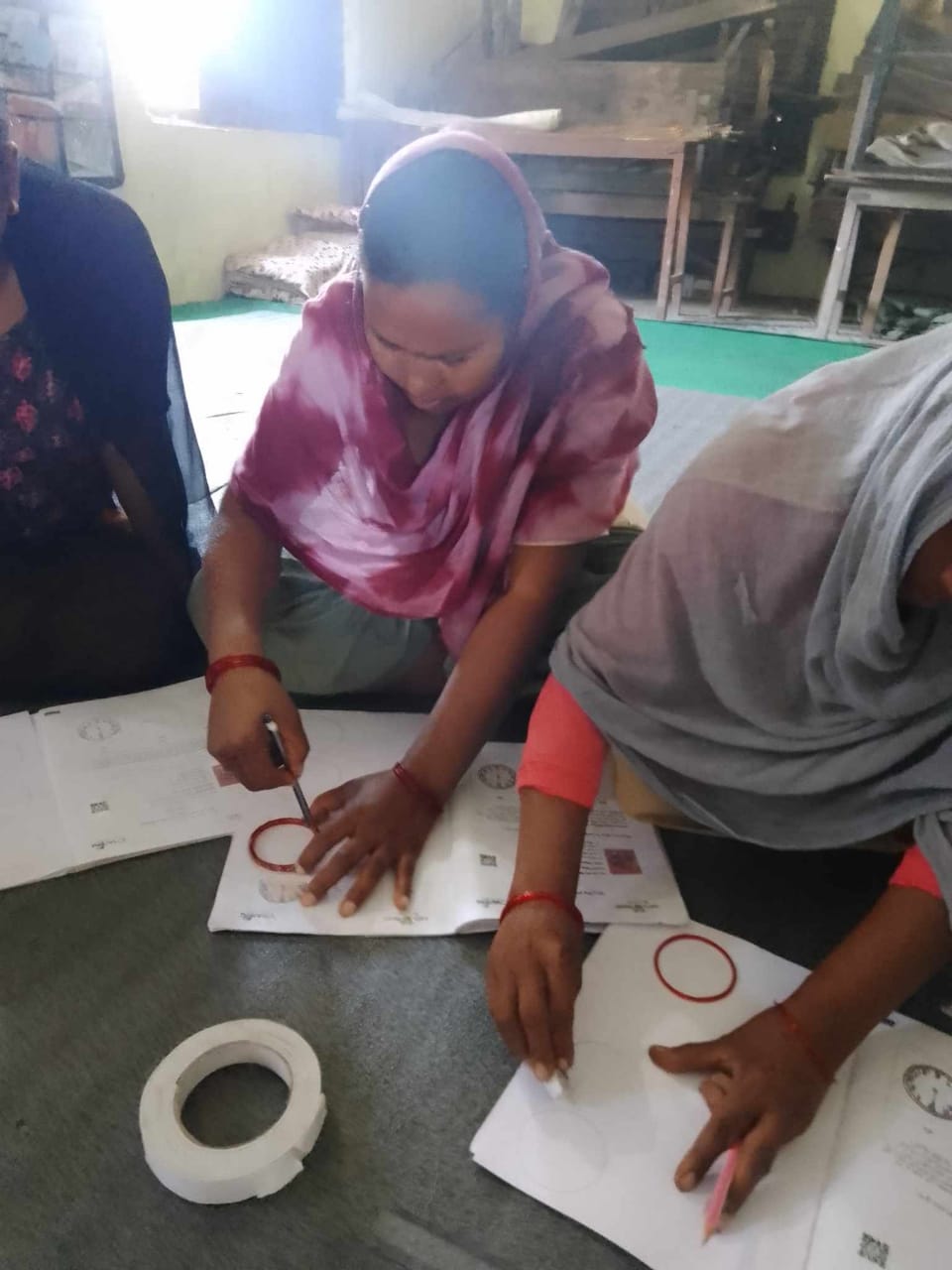 Urmila, along with other caregivers, engage in creation of learning materials (2)