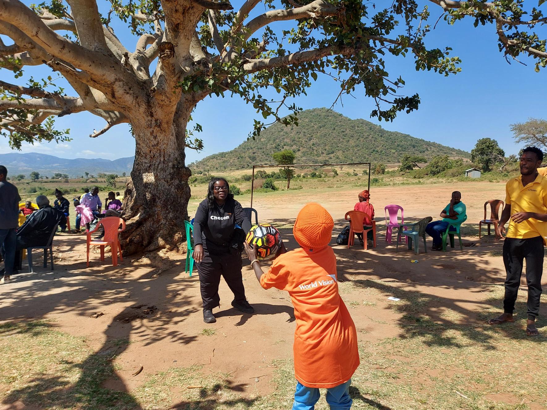 Vision Trip team playing with a child