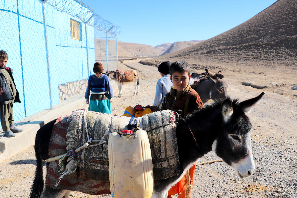 Residents of villages get purified and clean water from World Vision water purification centre.