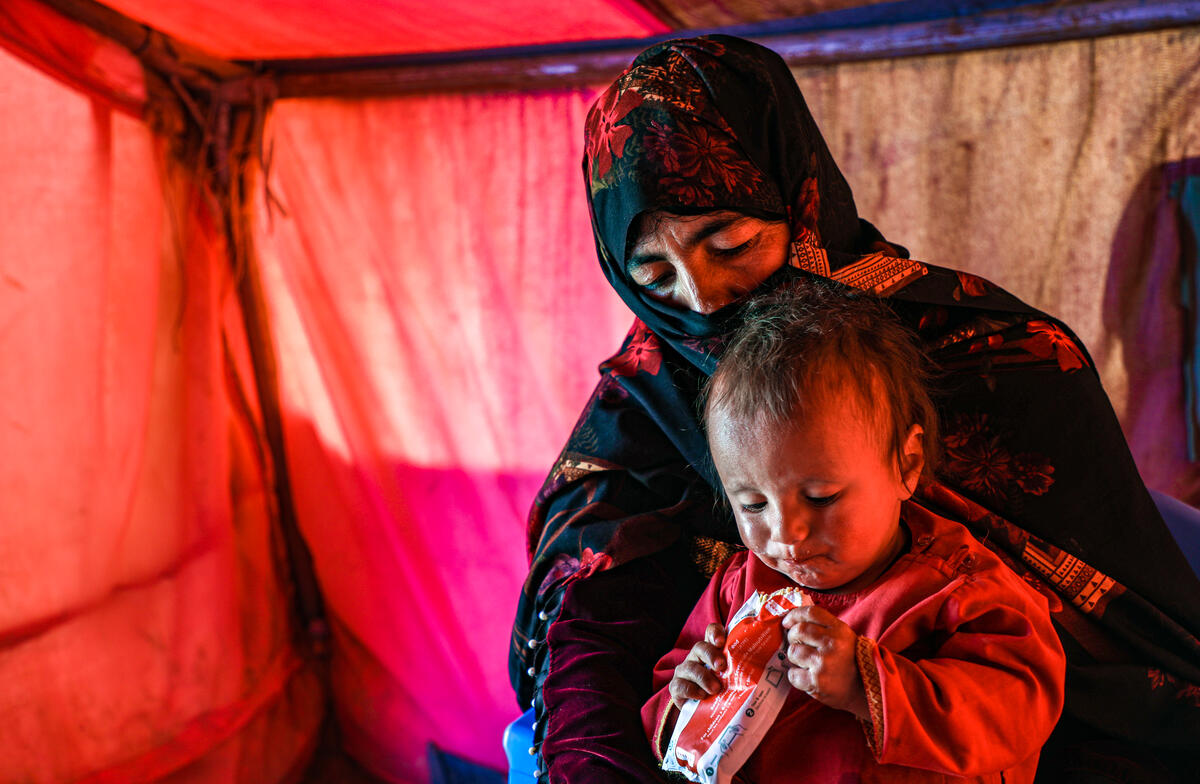 Child eating emergency food rations