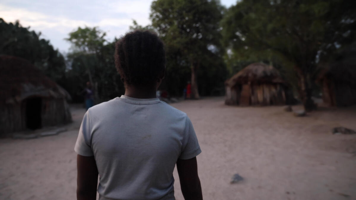 Teenage girl forced into prostitution to provide food for her family as a result of droughts in Angola.