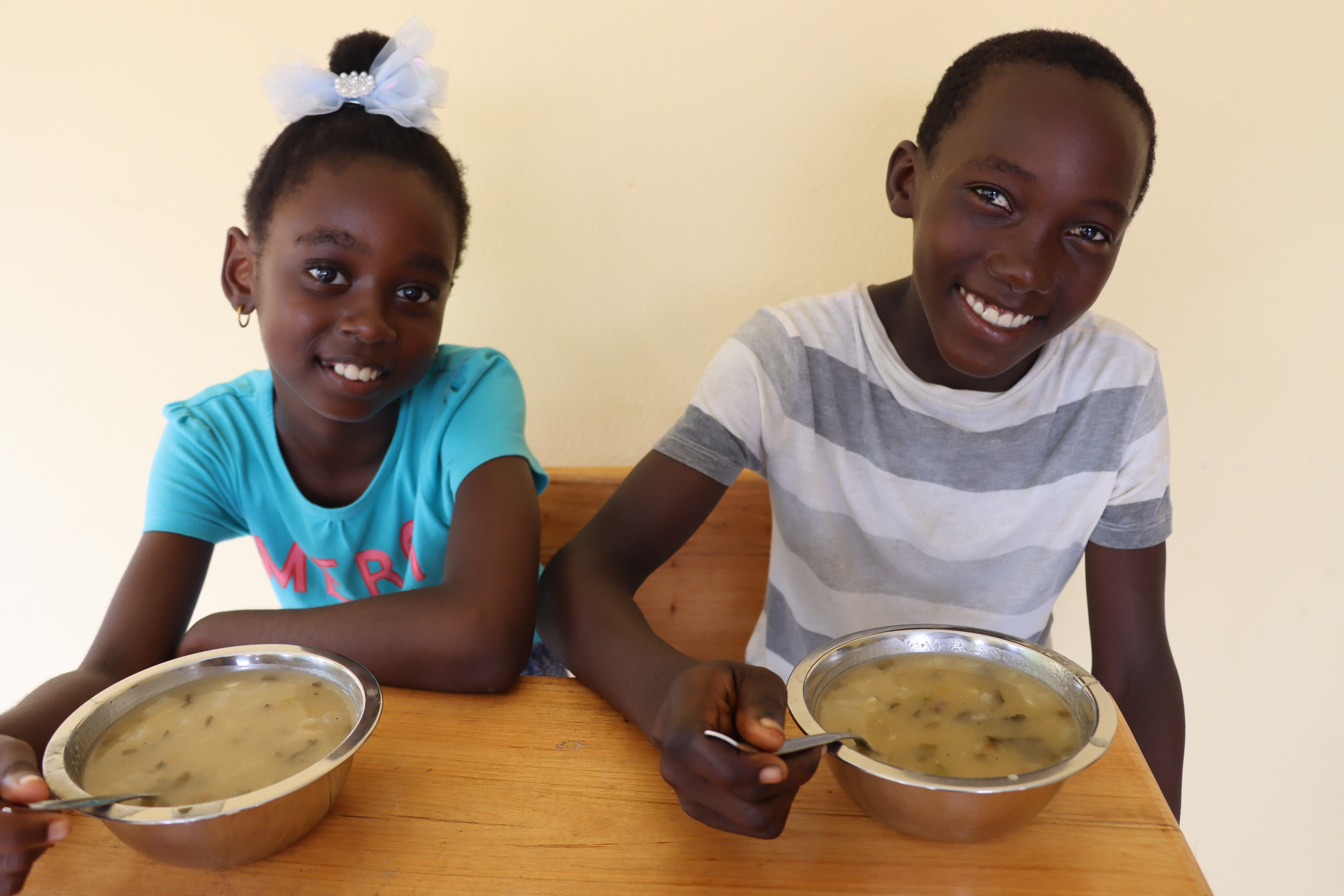 Children savouring school meals. Angola/ Cefora Jorge/2024.