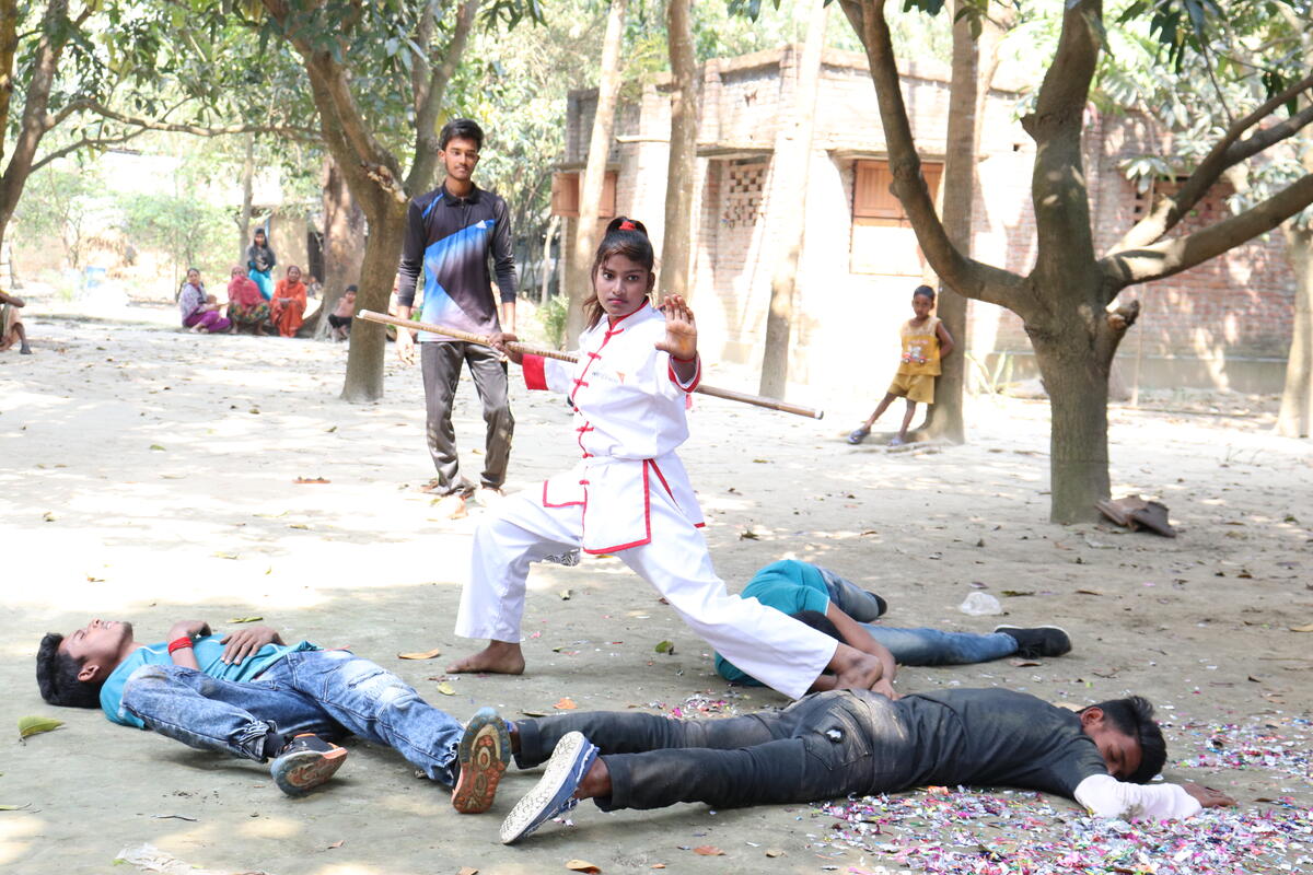 Simulations help the girls learn self-defence.