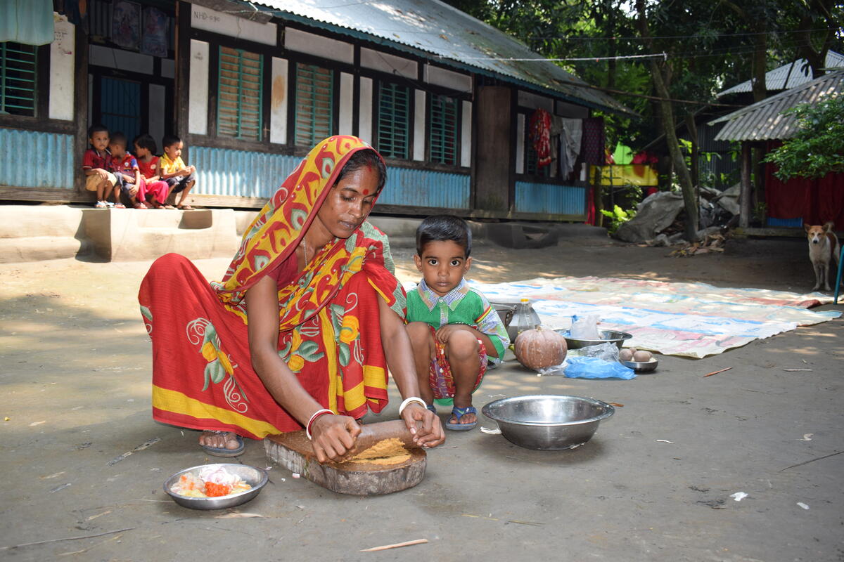 Woman feeds her child