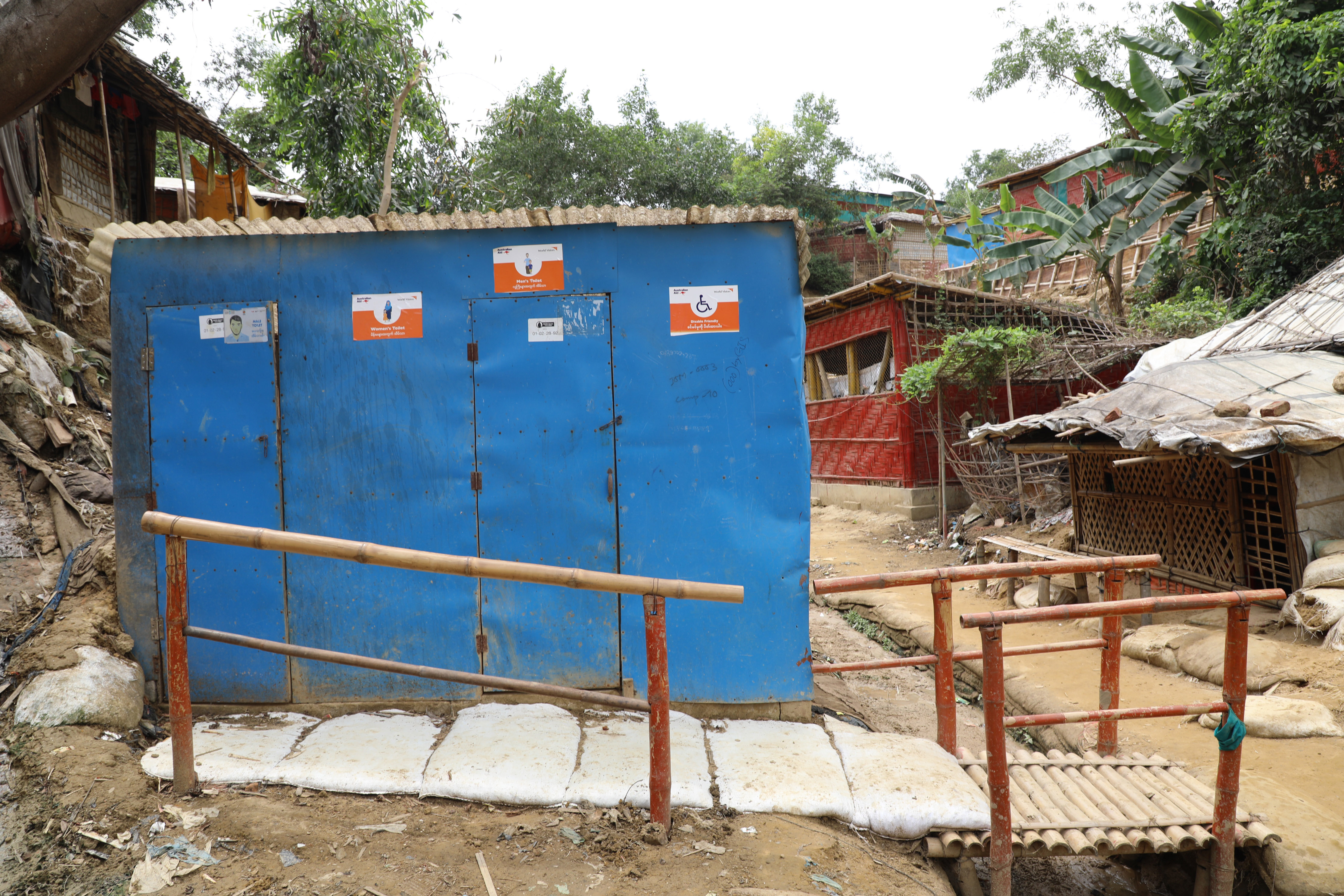  Disable friendly toilet with handrail from doorstep to latrine.