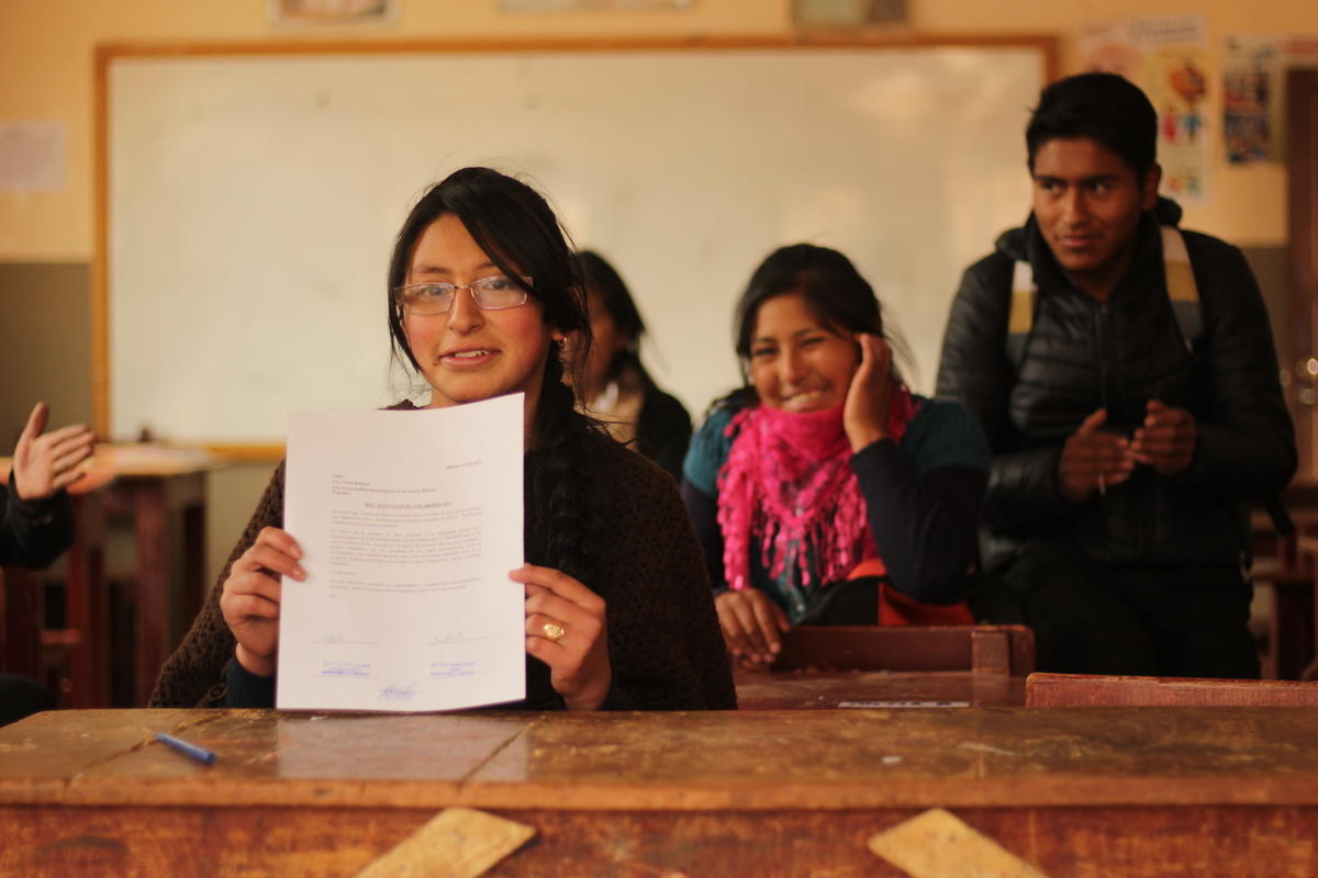 girl shows her leadership certificate 