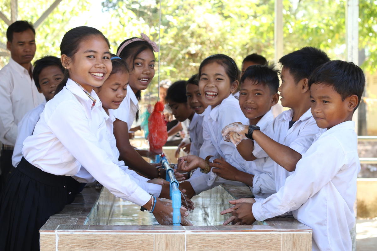 Children in cambodian school washing their hands