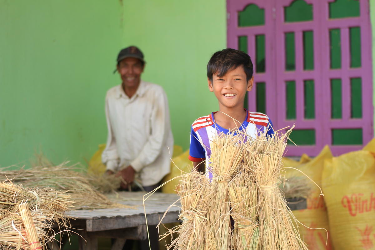 Chamrong and his father at their home in Cambodia.