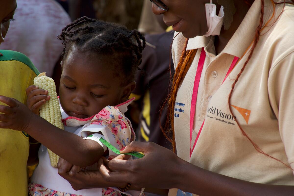 A child in the DRC is checked for malnutrition