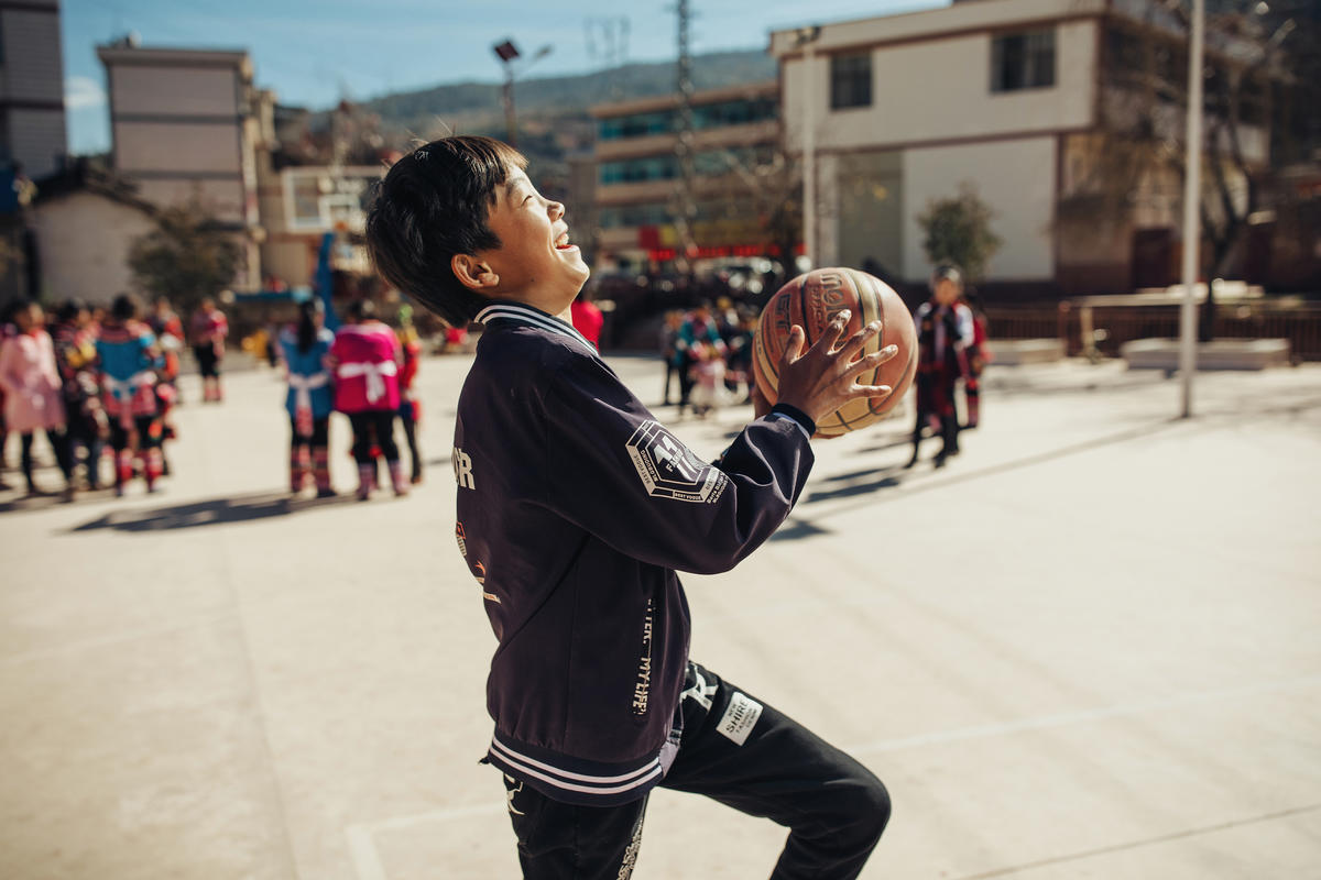 a child playing basketball