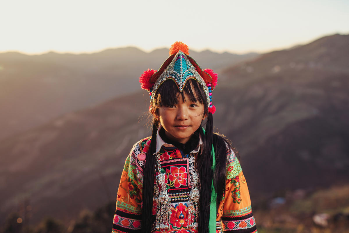 Sponsored child in China in traditional clothes