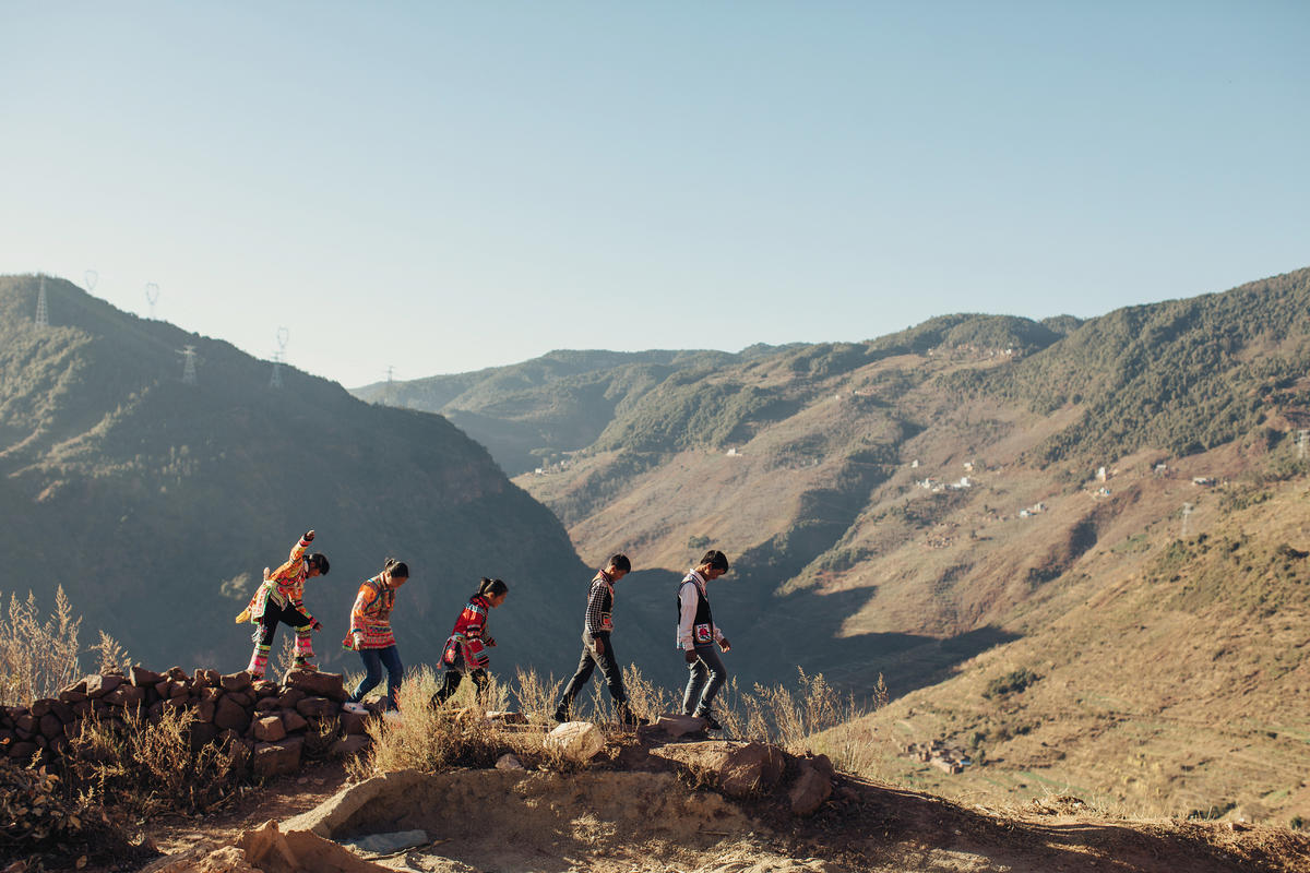 children walking behind each other