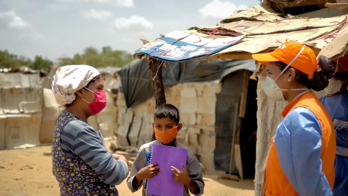 World Vision staff and volunteers monitor children’s safety