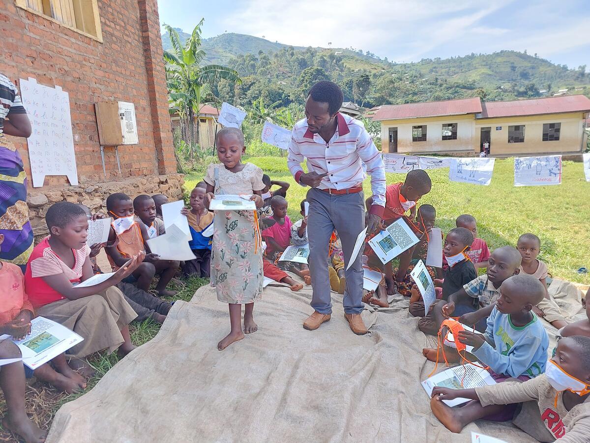 Lesline reading in front of her classmates