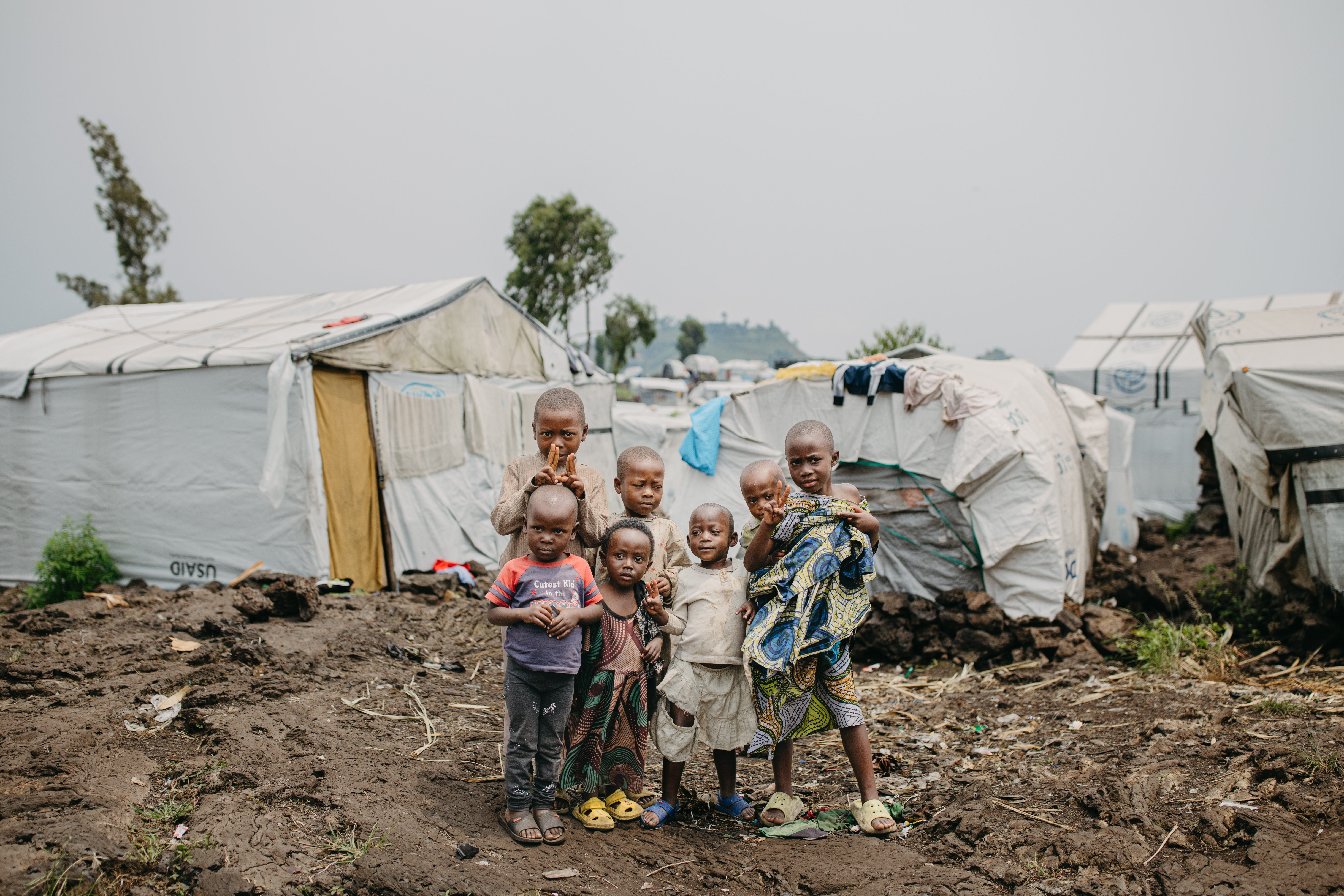 Children stand together in Bulengo IDP camp on the outskirts of Goma, DRC/2025.