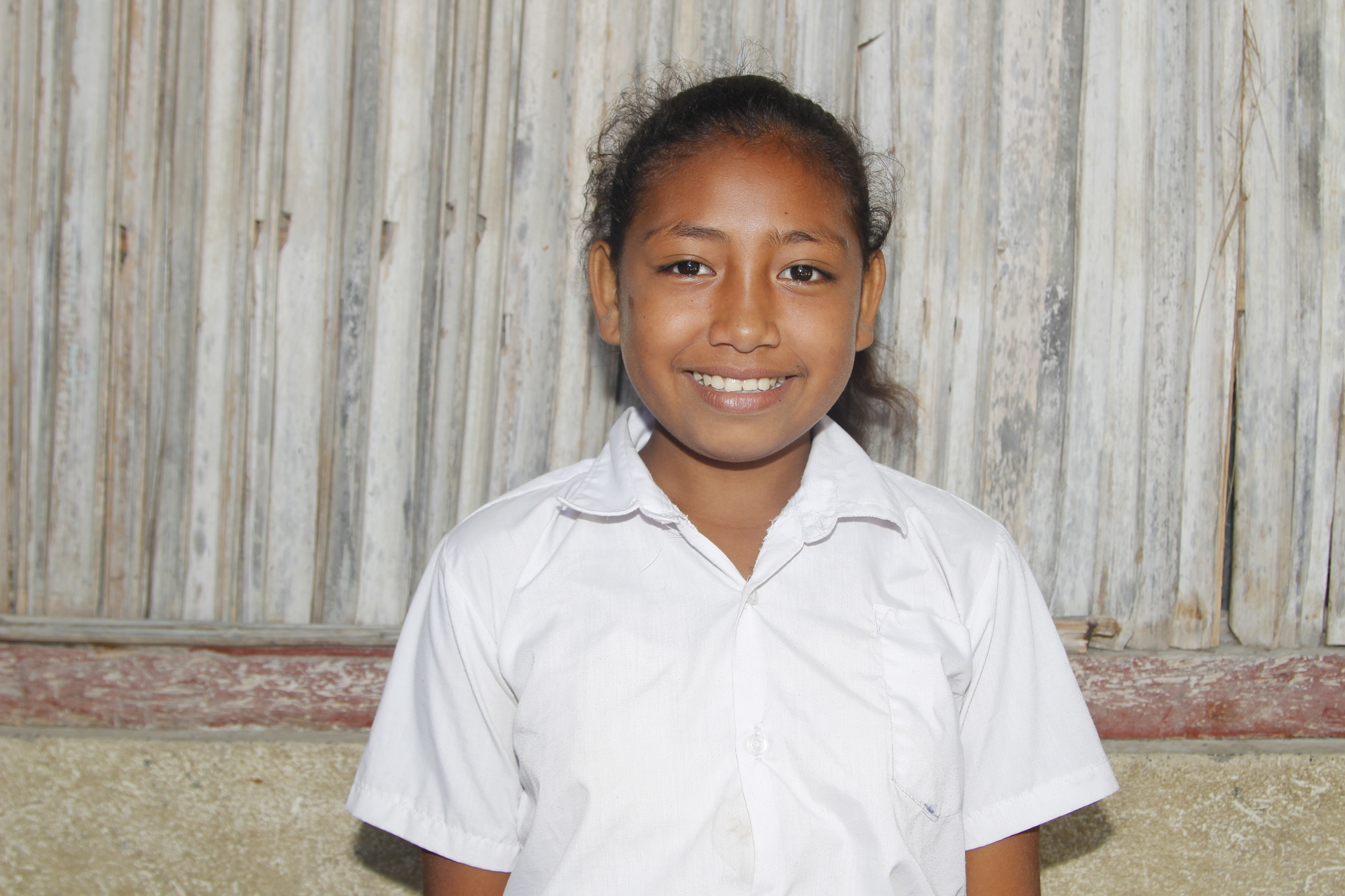 Maria, a Grade 6 student at a primary school, is happy to have the new water and sanitation facilities at her school. Photo: Jaime dos Reis/World Vision