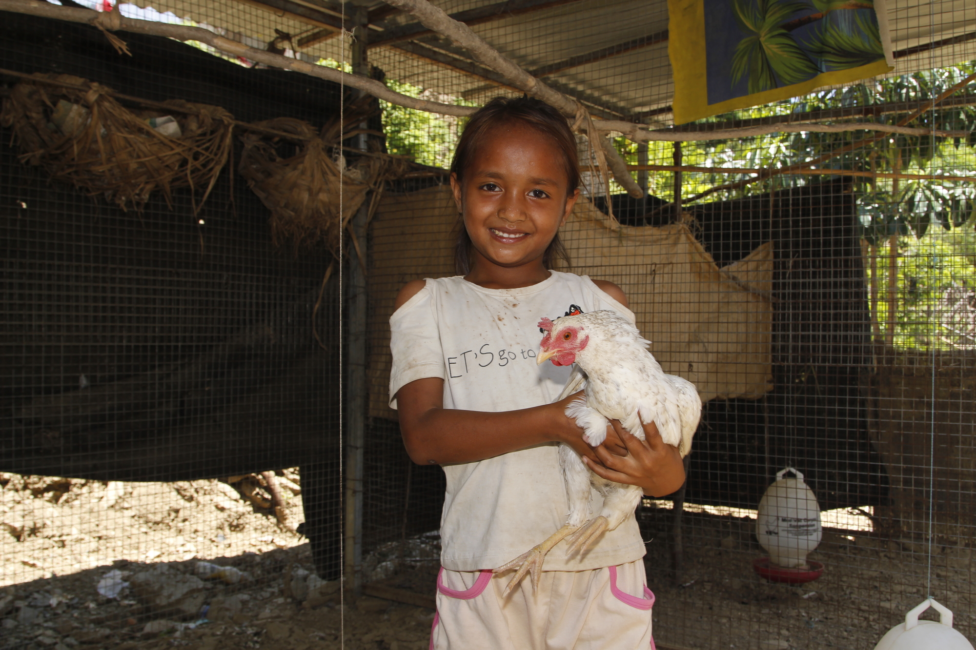 Alarico’s daughter Fersilia likes to eat the eggs from the chickens her parents raise. Photo: Jaime dos Reis/World Vision