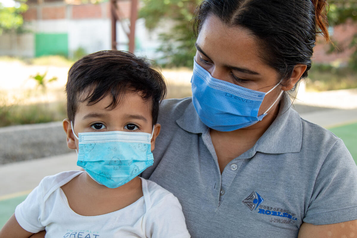 baby and mum in masks