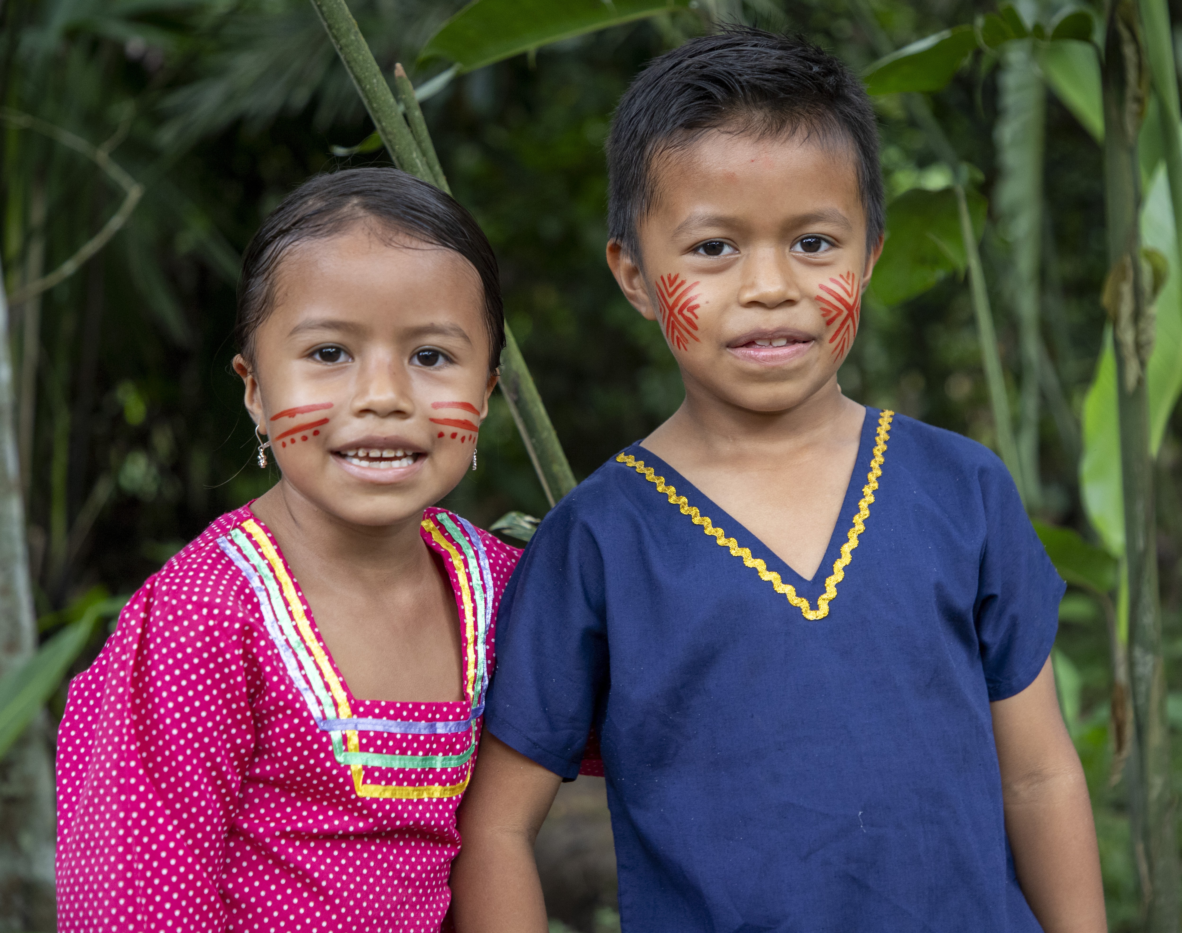 Children of the Ecuadorian Amazon standing proud in the heart of the rainforest.