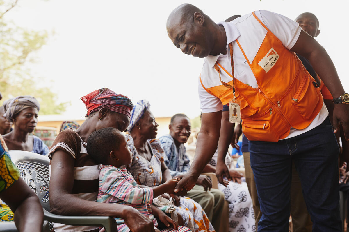 World Vision staff in Ghana meet with community members