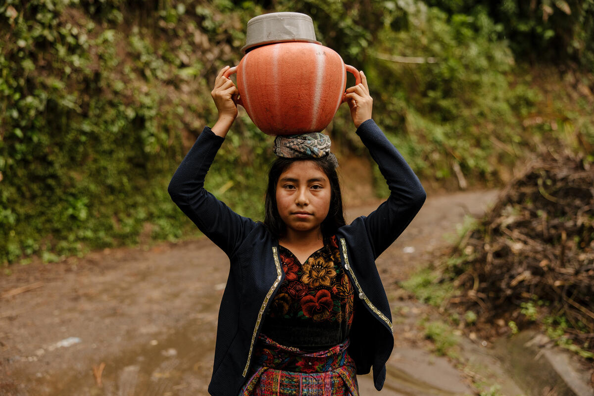 A girl carrying water