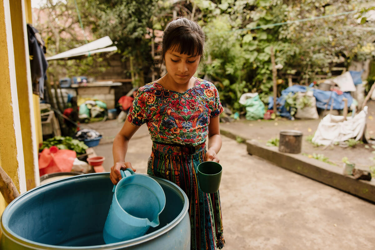 A girl filling water
