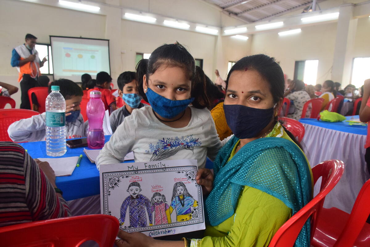 A family show the artwork made at the Celebrating Families workshop.