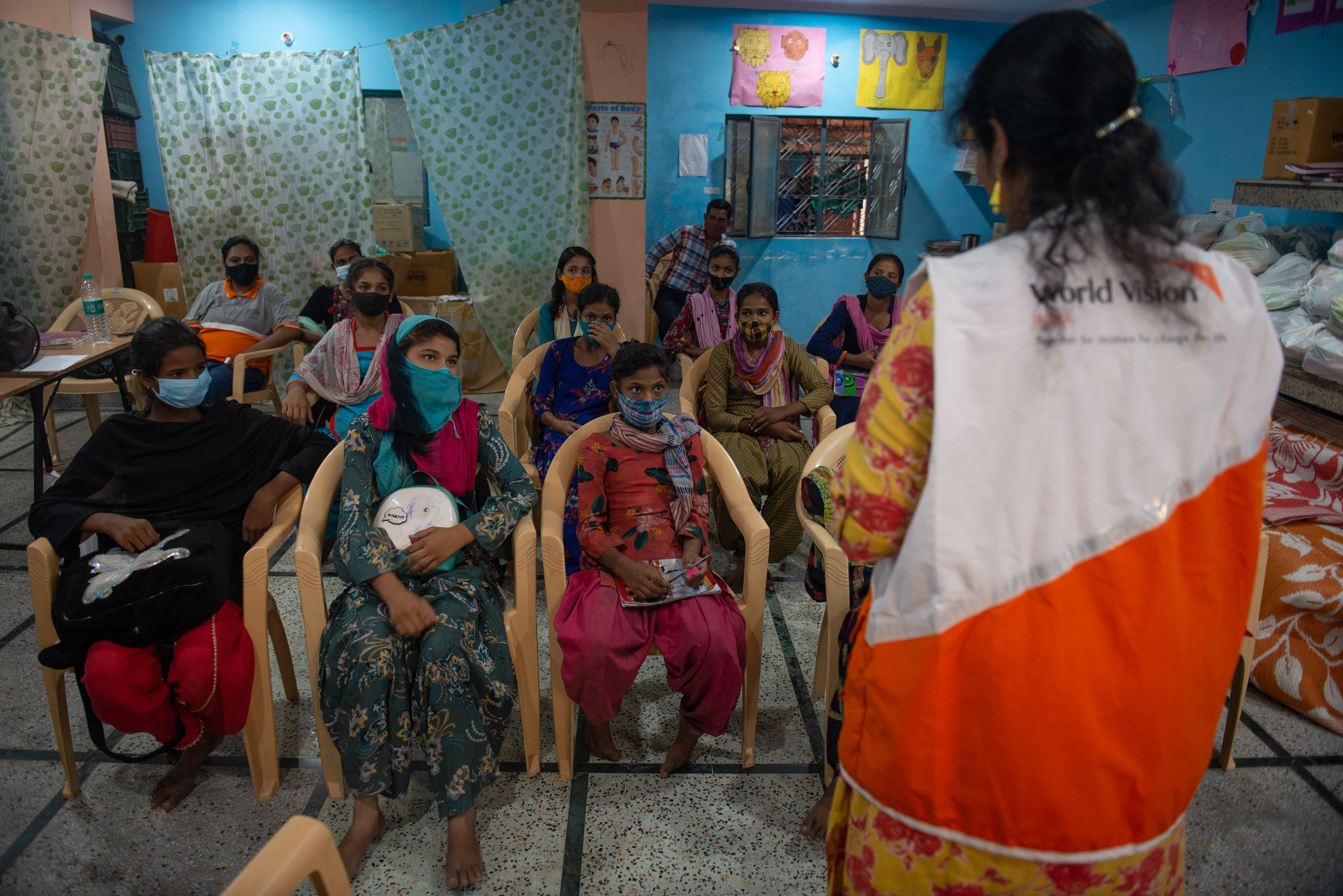 Mercy conversing with a group of community members in Delhi.