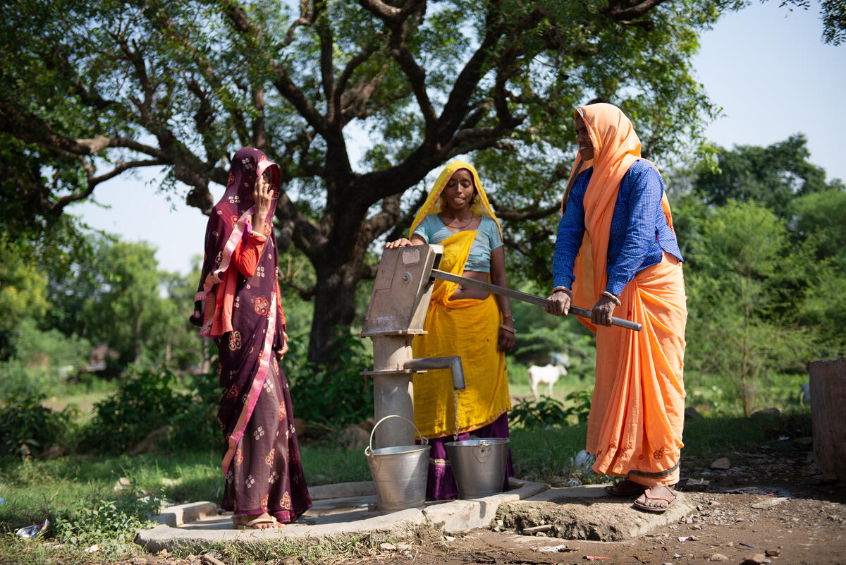 Women in this Alwar, India, village pump water.