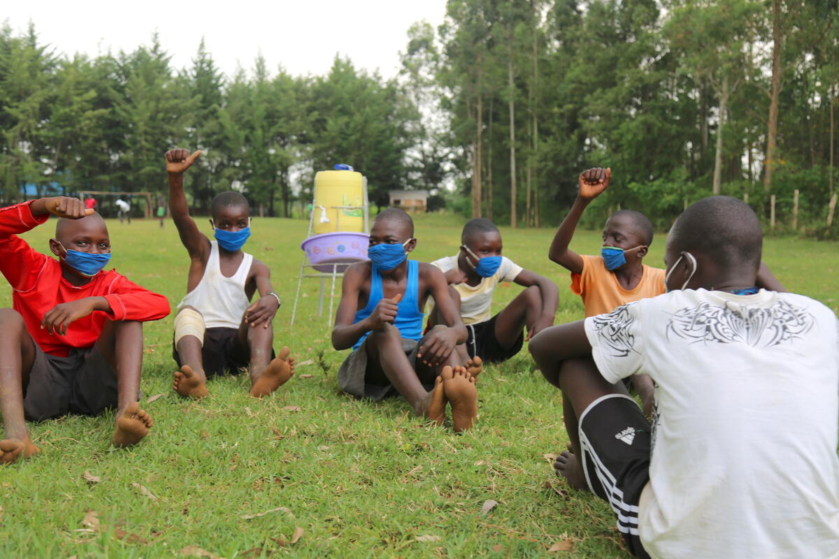 Raphael tells his other youth in his community how they can stay safe, espcially when playing games such as soccer.