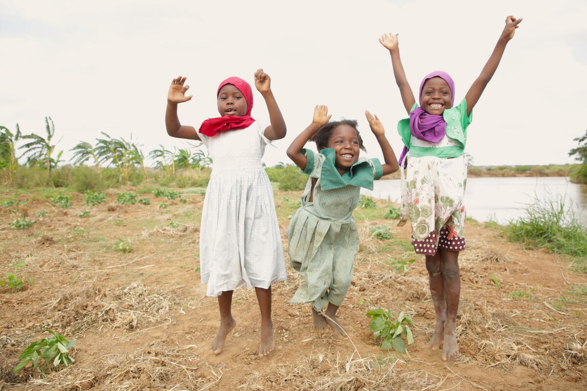 Healthy children jump for join in Kenya as diversified crops have helped reduce hunger.