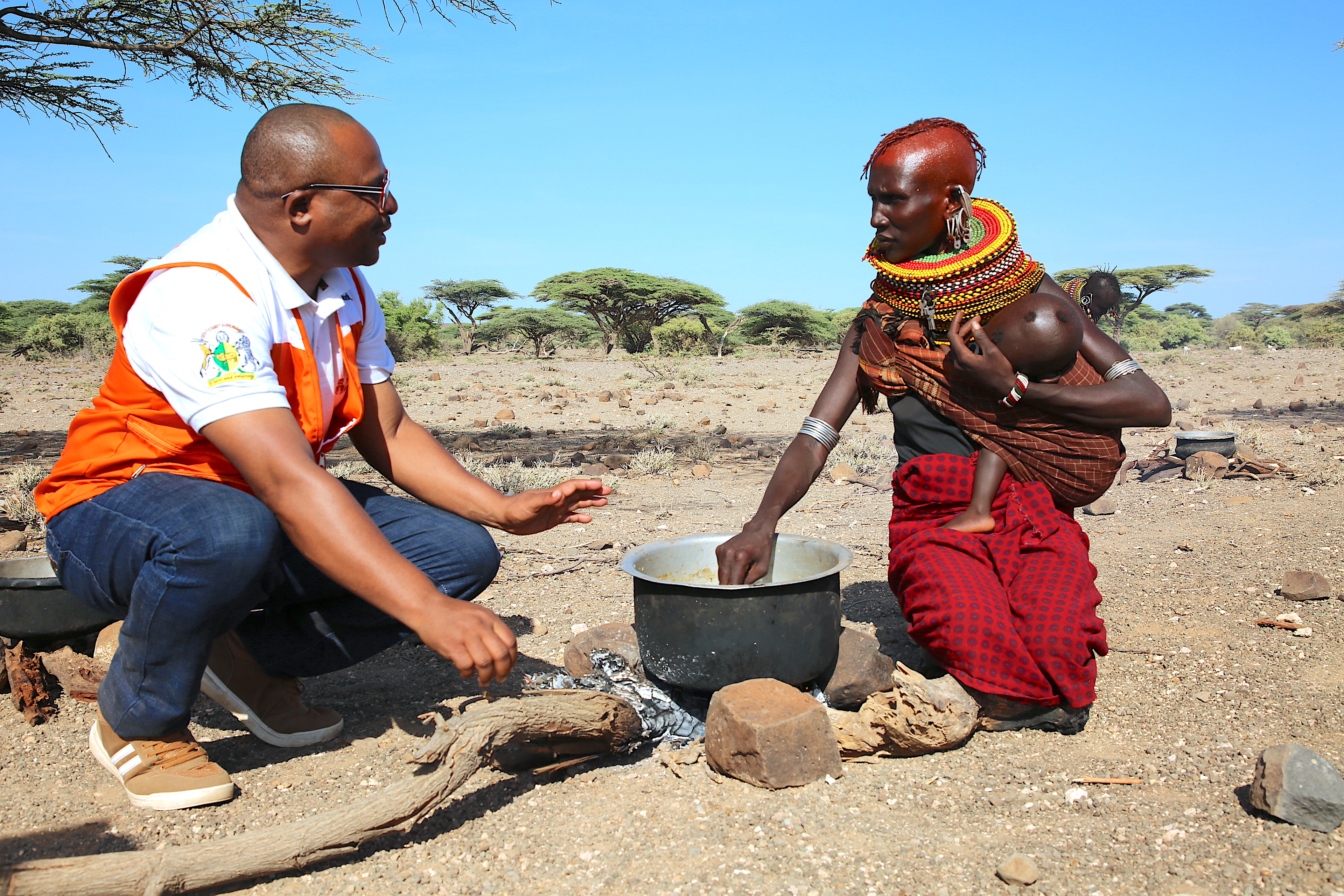World Vision staff interacting with community member in Marsabit, Kenya