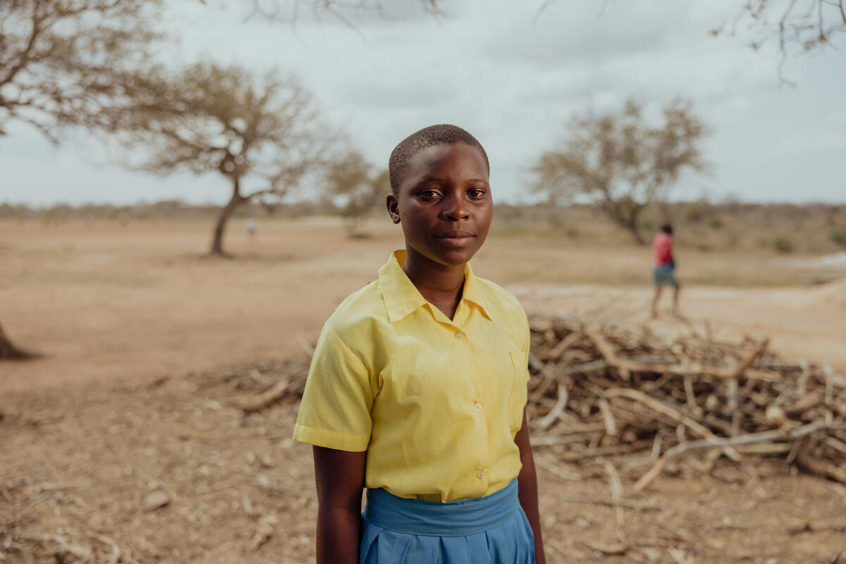 Faith, 15, poses for a picture in a field.