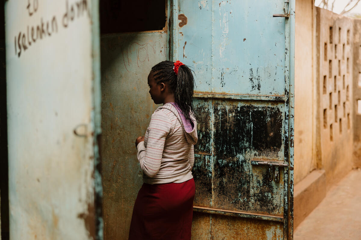 Miriam entering a building