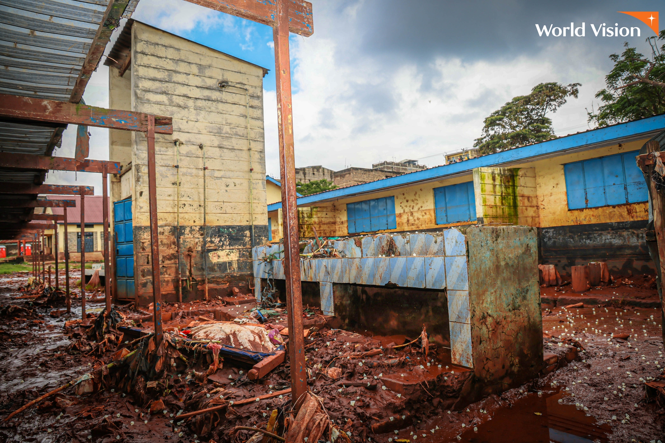 Mathare North Primary School in Kenya was devastated by floods, destroying classrooms and property worth millions, including books, certificates, and computers.