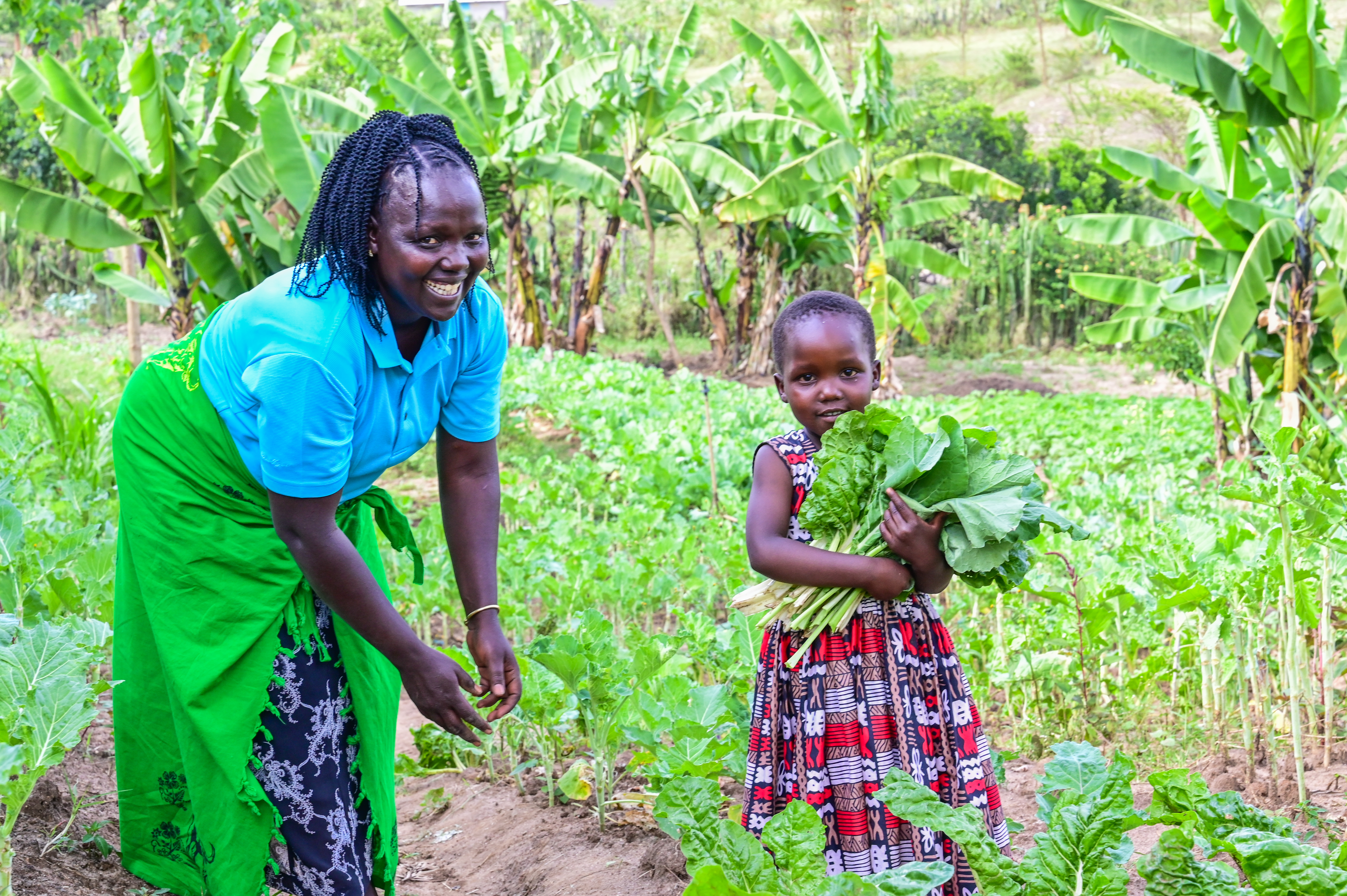 A mother and her daughter  are able to get ENOUGH nutritious food from their farm.