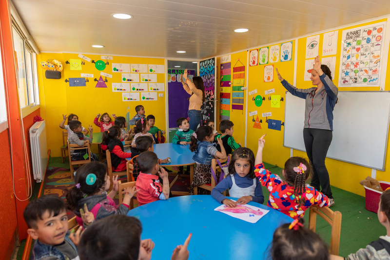 Children learn letters and numbers in an early childhood education programme in Bekaa Valley, Lebanon.