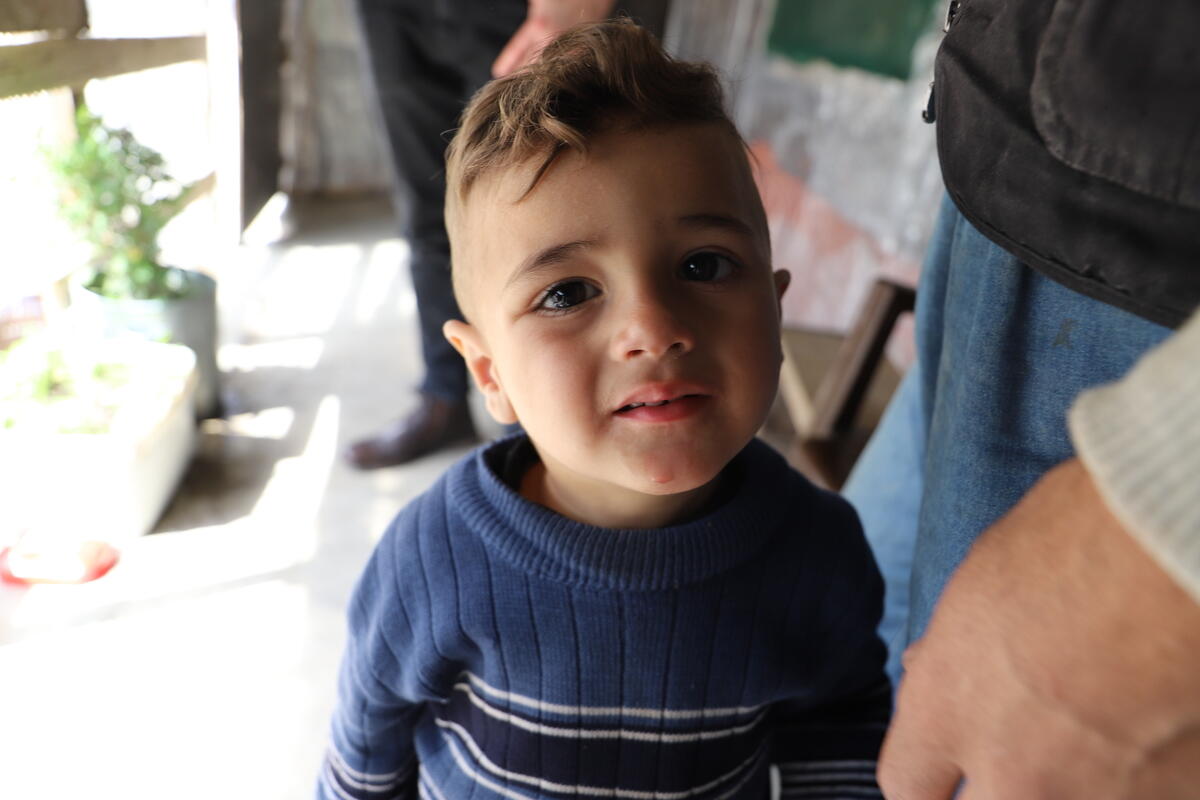 A child receives food distribution from World Vision's Syria Response.